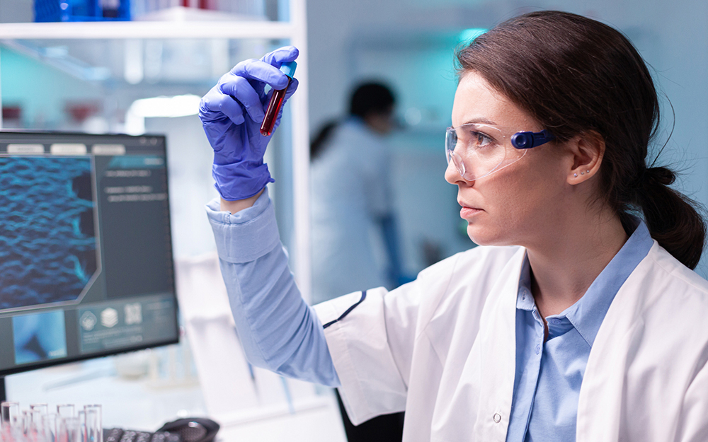 Marine biologist analyzes a tube for scientific research